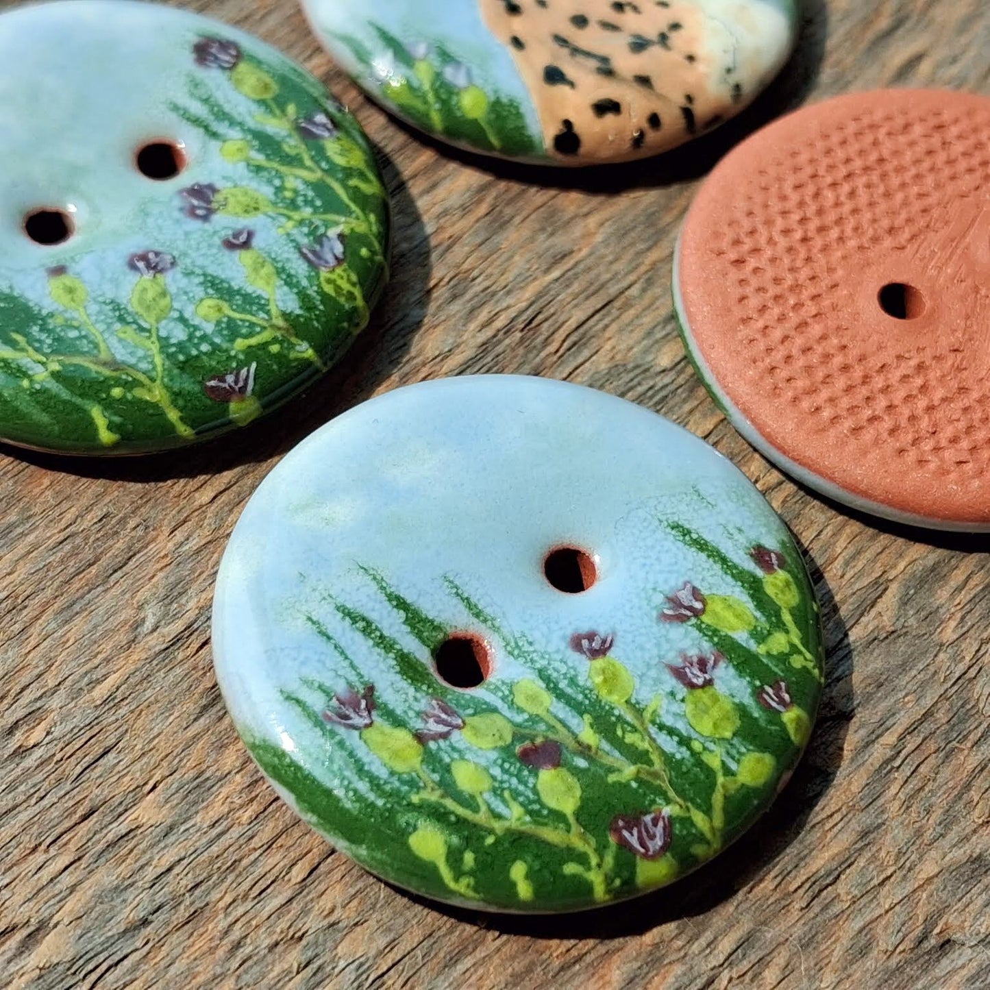 ‘Lynx in Thistle’ 1-1/16” one-of-a-kind 4-pack